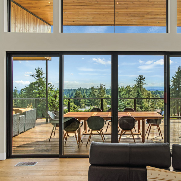 View through the large sliding doors of a modern home built by Mike Riddle Construction View through the large sliding doors of a custom home built by Mike Riddle Construction