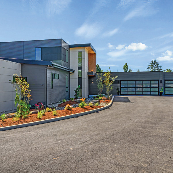 Driveway entrance of an industrial modern home built by Mike Riddle Construction Driveway entrance of an industrial modern home built by Mike Riddle Construction