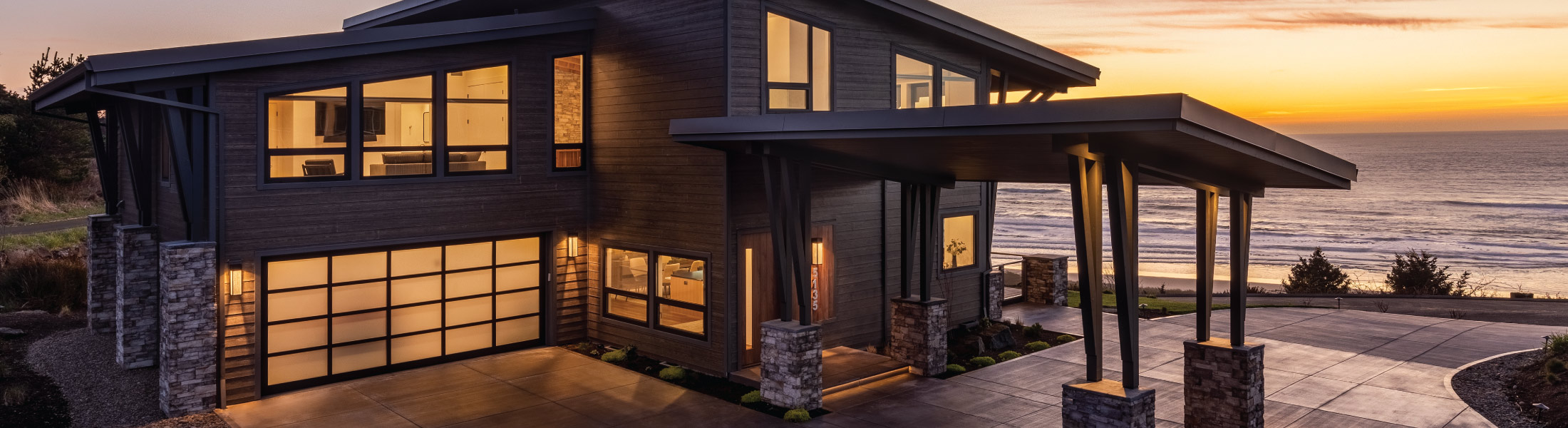 Exterior of a custom modern coastal home built by Mike Riddle Construction